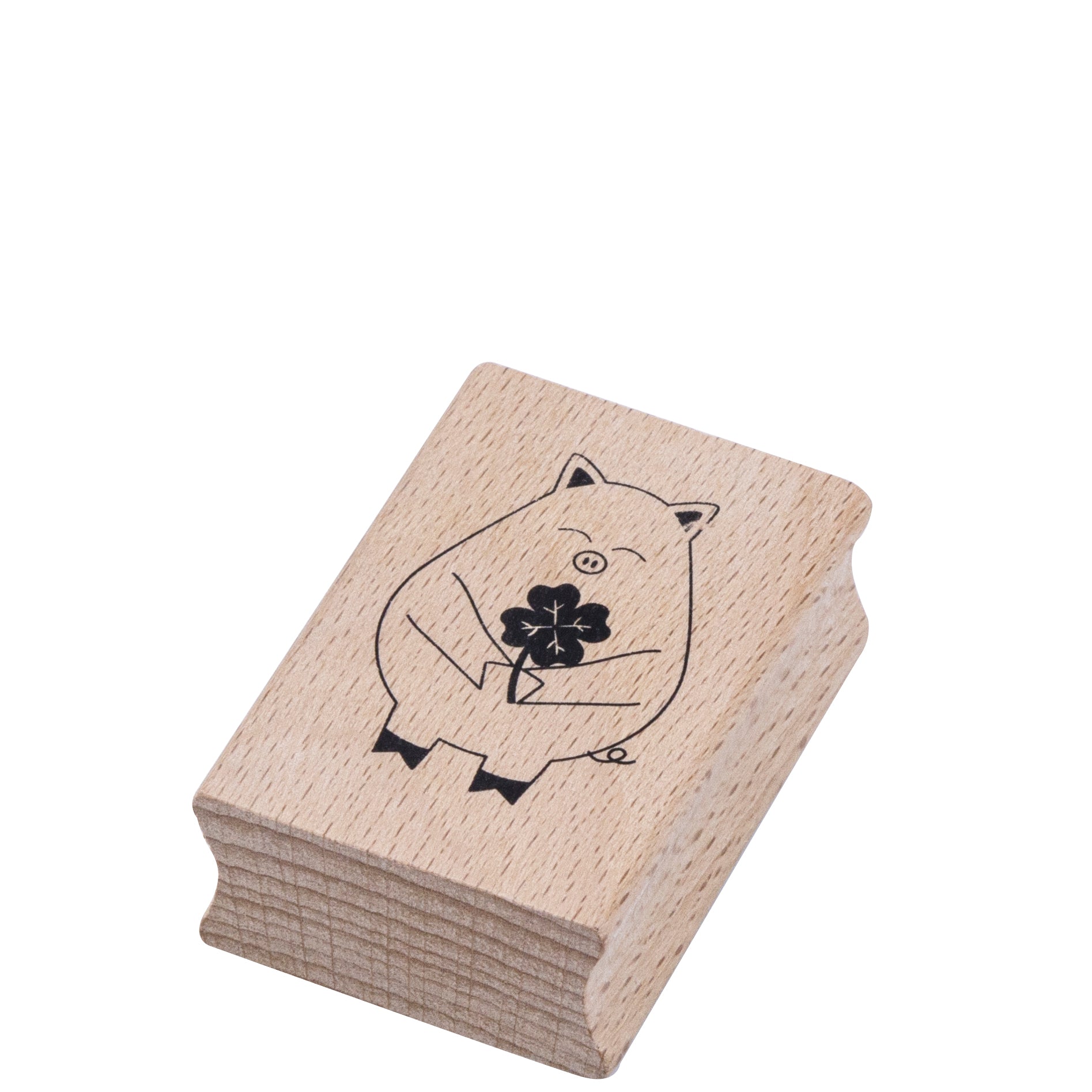 Der Stempel Glücksschweinchen von Artoz Papier AG ist ein Holzstempel mit einem lächelnden Schwein, das ein vierblättriges Kleeblatt hält - ideal für Bastelarbeiten und Glücksbasteleien.