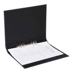 Une feuille ouverte d'Artoz Papier AG A4 Ordner schmal en Leinenoptik noir montre une feuille de notes à faire avec un agenda hebdomadaire et des notes lignées - idéal pour tout Home-Office-Ausstattung.
