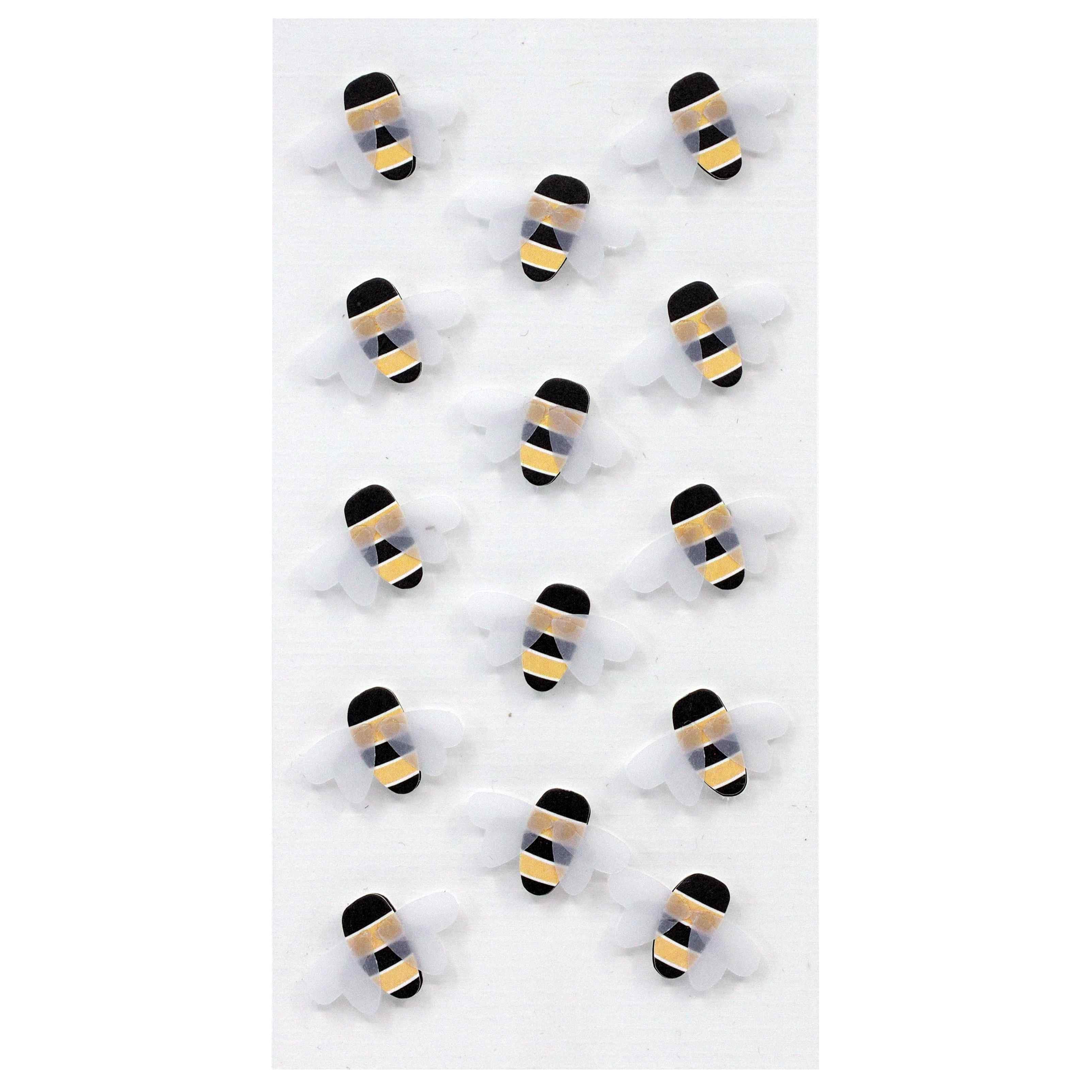 Quinze autocollants Artoz 3D "Biene" d'Artoz Papier AG sont disposés en rangs bien ordonnés sur un fond blanc. Chaque autocollant présente une tête noire, un corps rayé noir et jaune et des ailes blanches dans un charmant design suisse.