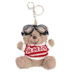 Le porte-clés « Teddy » – ours en peluche avec lunettes de ski, créé par Artoz Papier AG, représente un adorable ours en peluche portant des lunettes de ski noires et un pull en tricot rouge et blanc bien douillet, assis, les bras levés. Il constitue ainsi un cadeau d'hiver idéal sous la forme d'un charmant porte-clés.