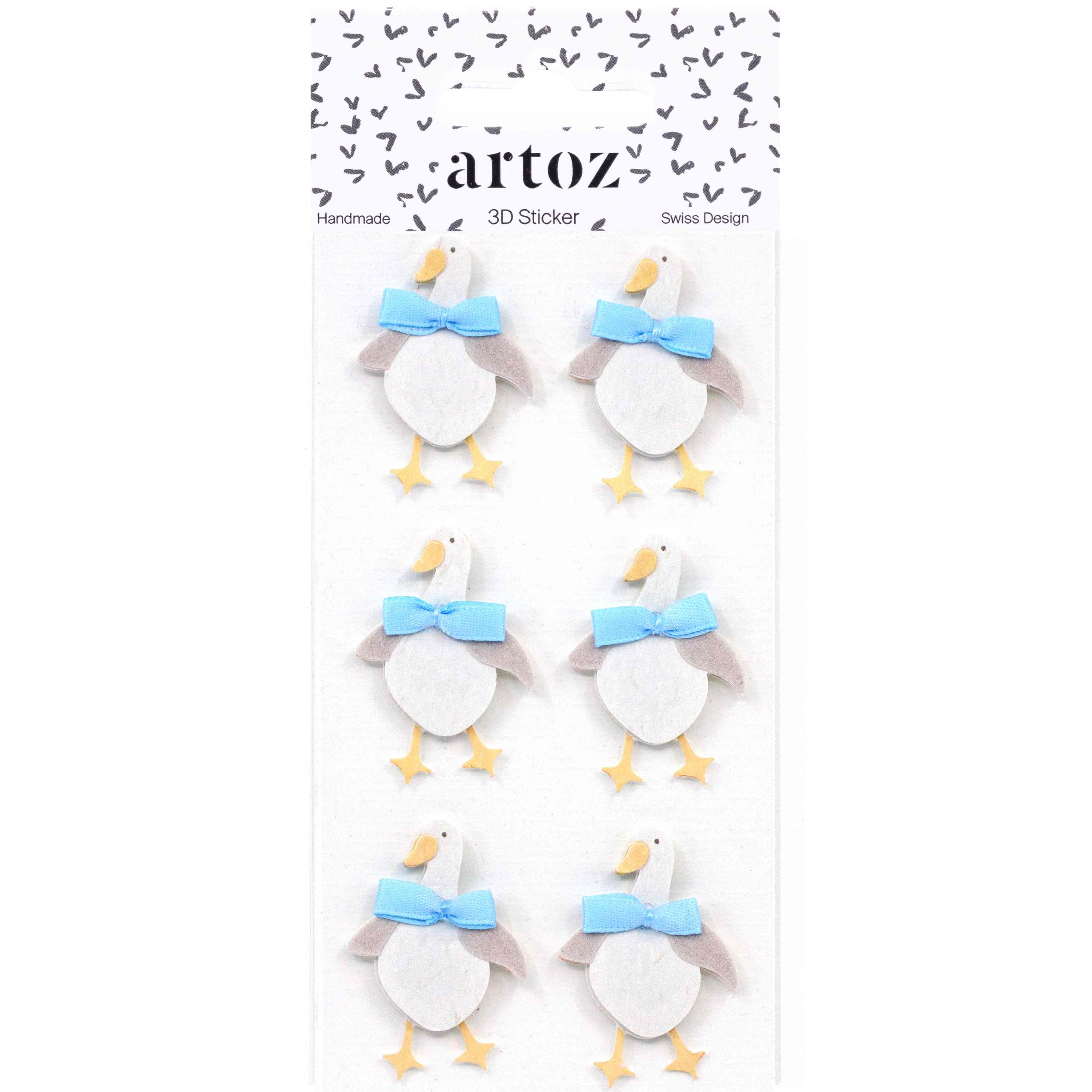 Artoz 3D Sticker Gans d'Artoz Papier AG représente six canards blancs aux ailes grises, au bec et aux pattes orange, chacun avec un nœud bleu clair. Disposés en deux colonnes sur un support blanc, ils sont parfaits pour les projets de bricolage.