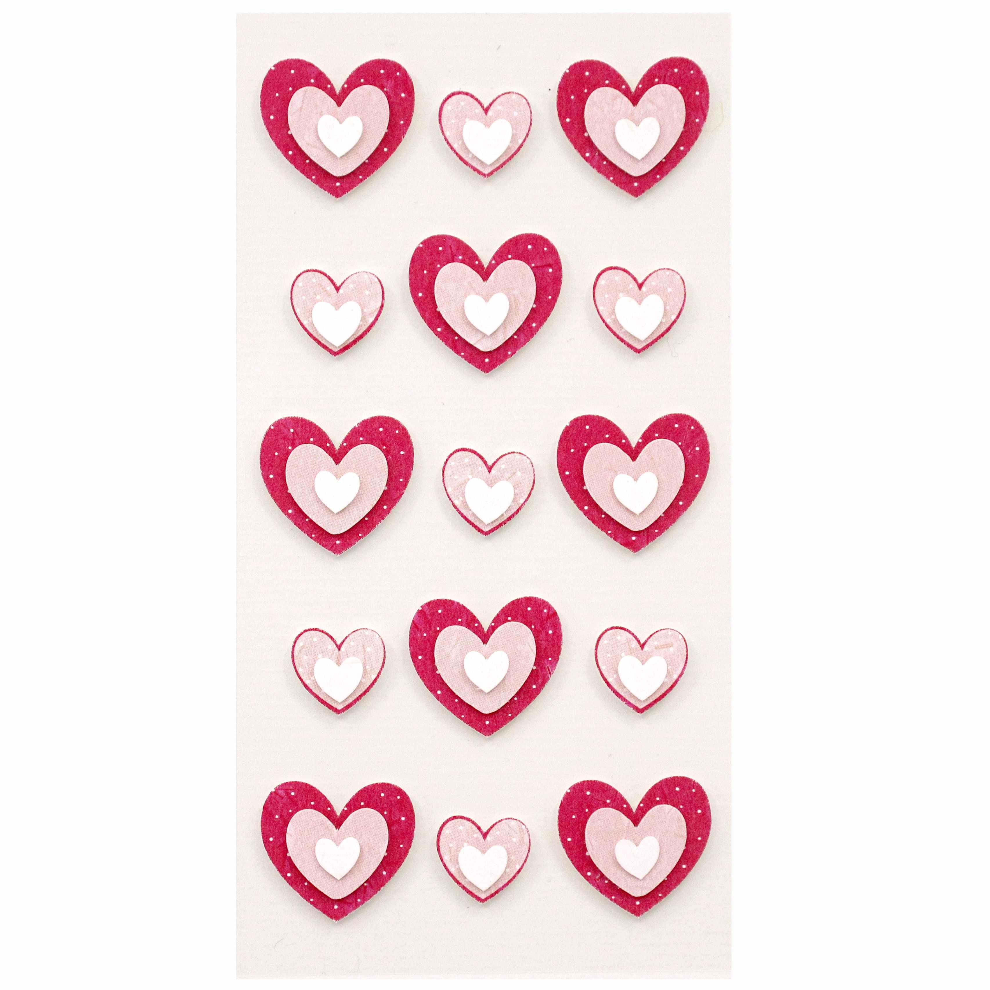 Une feuille d'Artoz 3D Sticker "Herzen" d'Artoz Papier AG comprend 15 autocollants artisanaux en forme de cœur avec des cœurs rouges ou roses à l'extérieur et des cœurs blancs plus petits à l'intérieur, soigneusement disposés sur un fond blanc.