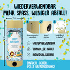 L'infographie allemande colorée montre le Tischbombe ohne Feuer d'Artoz Papier AG - Happy Birthday Boy : tirez l'épingle à nourrice, appuyez sur le bouton, et profitez d'une explosion de confettis en toute sécurité et pleine de surprises. Les caractéristiques comprennent une utilisation facile, un design personnalisable et un plaisir festif pour tous les anniversaires !.