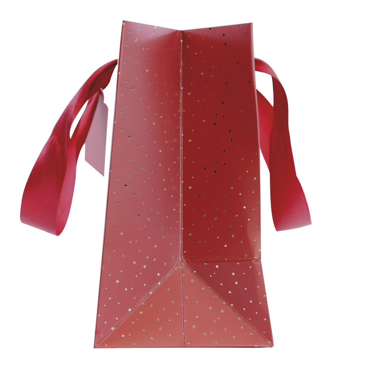 Une vue de profil du sac cadeau « Pure M Weihnachtlich » de la société Artoz Papier AG, dans des tons festifs de rouge et d'or, orné de pois dorés et de larges poignées en ruban rouge sur fond blanc.