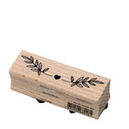 Le Stempel Pflanze d'Artoz Papier AG représente un cœur noir entre deux branches feuillues - idéal pour les Bastelarbeiten ou les Einladungskarten. Le code-barres et les informations sur le produit apparaissent au recto.