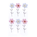 Six autocollants Artoz 3D "Blume" d'Artoz Papier AG, disposés en deux rangées de trois, présentent des pétales roses ou bleus, des centres jaunes et des tiges/feuilles noires et blanches sur un fond blanc.