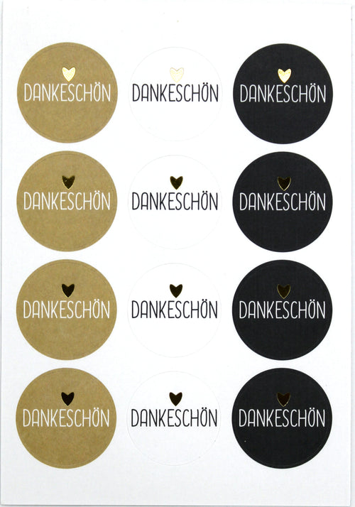 L'Artoz Sticker Dankeschön d'Artoz Papier AG propose des autocollants ovales avec un cœur doré au-dessus de "Dankeschön" sur fond doré, blanc ou noir - idéal pour les projets DIY Deko. Chaque feuille présente les autocollants dans une grille ordonnée.