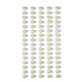 Une grille de petites perles blanches rondes Artoz Strass Sticker Perle d'Artoz Papier AG forme sept colonnes verticales sur un fond blanc - idéal pour le scrapbooking ou comme embellissement délicat d'un autocollant 3D.